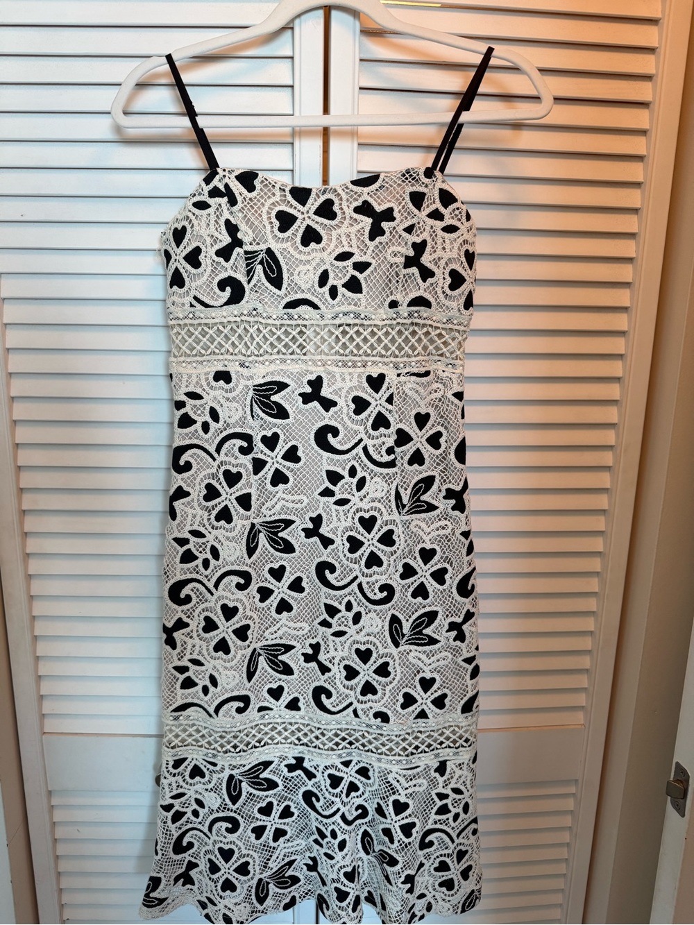 Unworn black-and-white crochet/lace dress